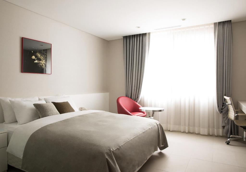 Postel nebo postele na pokoji v ubytování Hotel Mate Bundang