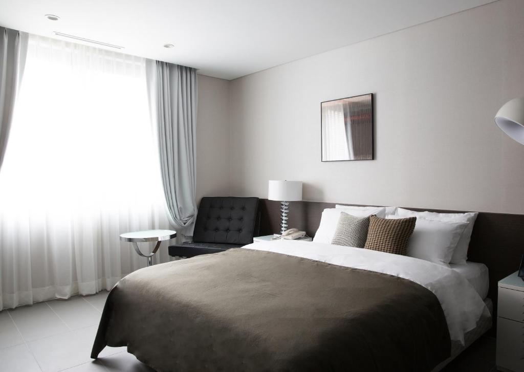 Postel nebo postele na pokoji v ubytování Hotel Mate Bundang