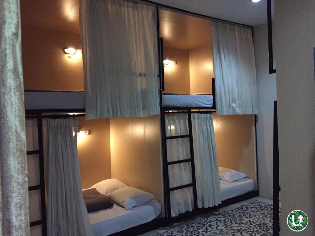 Postel nebo postele na pokoji v ubytování Ubud Tropical