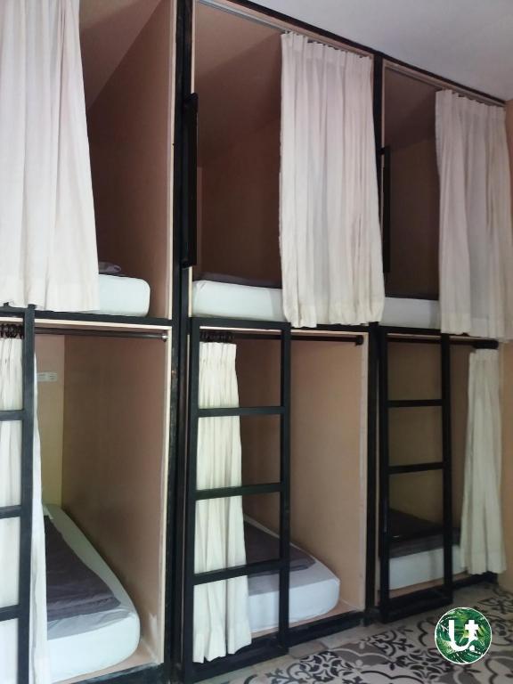 Postel nebo postele na pokoji v ubytování Ubud Tropical