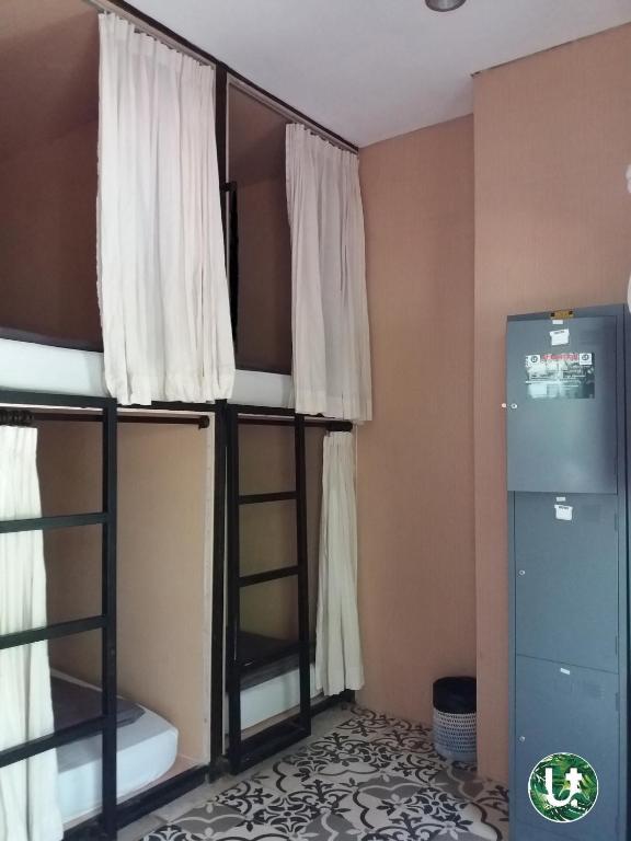 Postel nebo postele na pokoji v ubytování Ubud Tropical