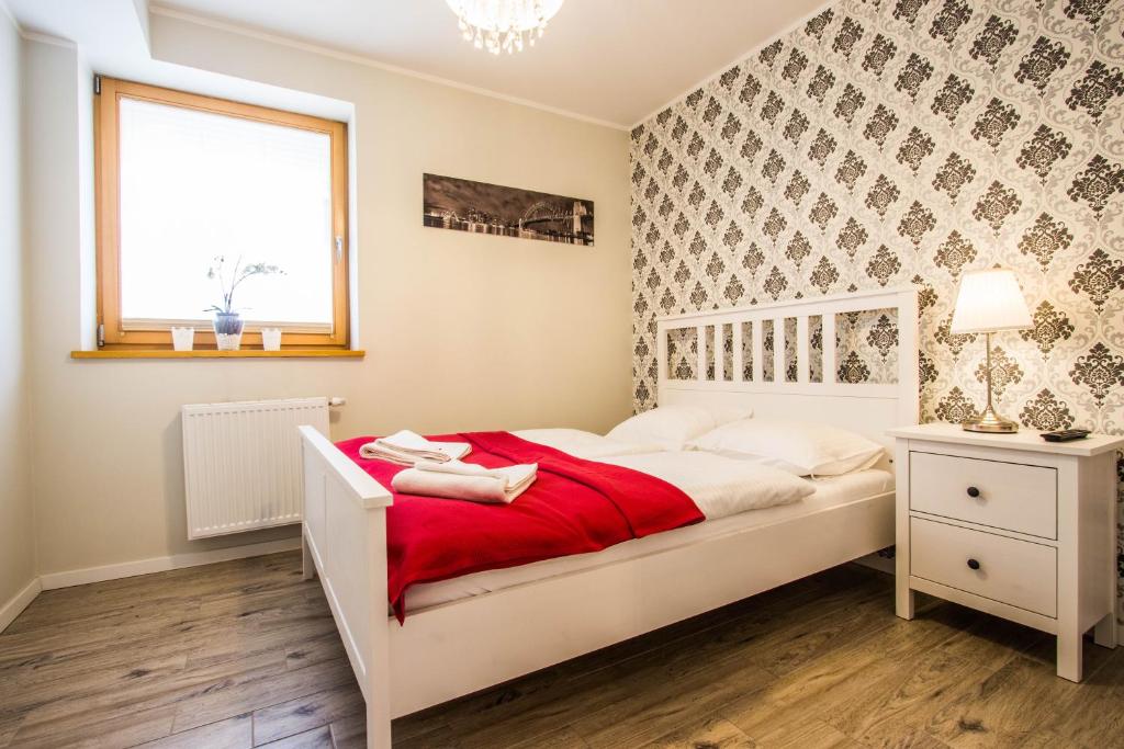 Posteľ alebo postele v izbe v ubytovaní Apartamenty Smrekowa Lux Zakopane