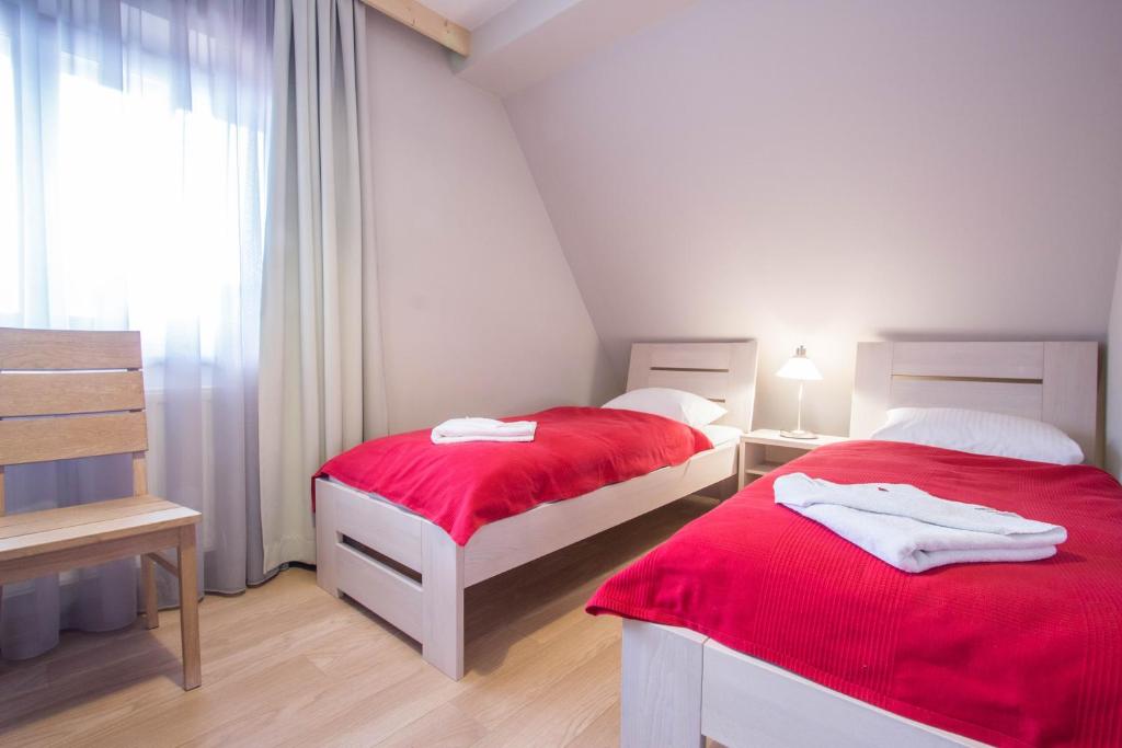 Posteľ alebo postele v izbe v ubytovaní Apartamenty Smrekowa Lux Zakopane
