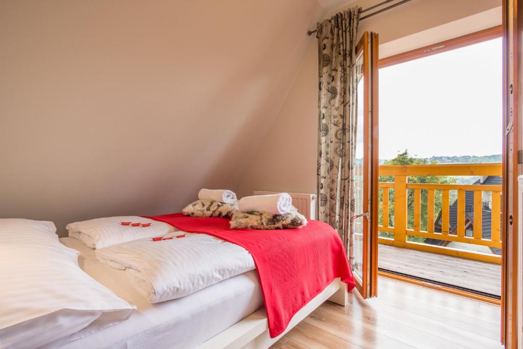 Posteľ alebo postele v izbe v ubytovaní Apartamenty Smrekowa Lux Zakopane