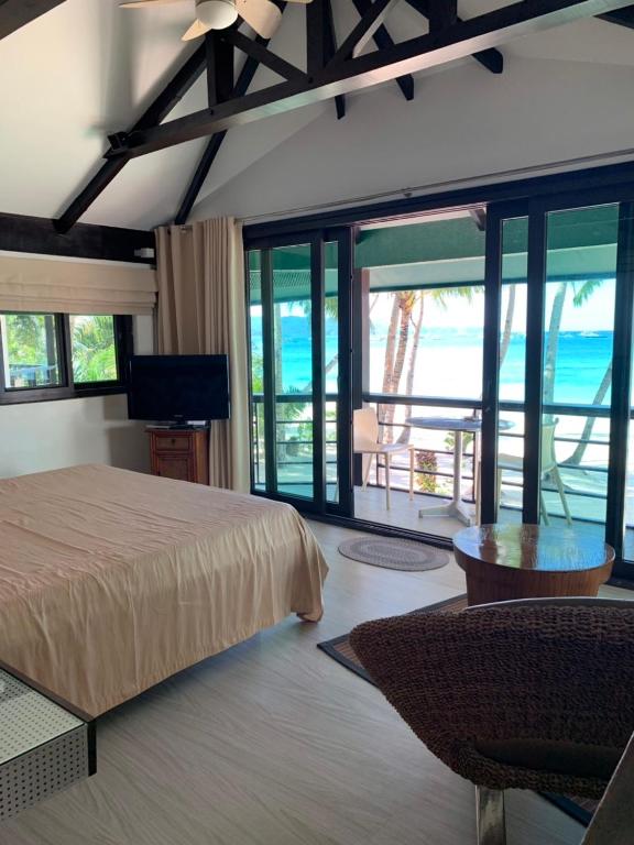 Postel nebo postele na pokoji v ubytování Boracay Beach Houses