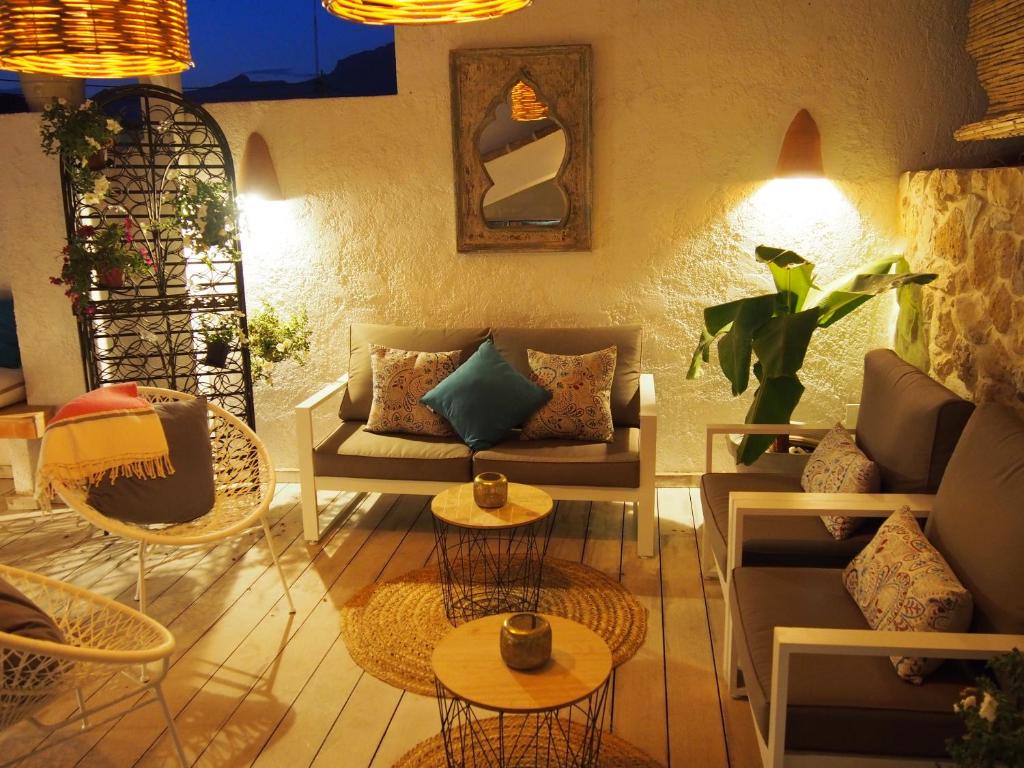 a living room with couches and tables at Hotel Abaco Altea in Altea
