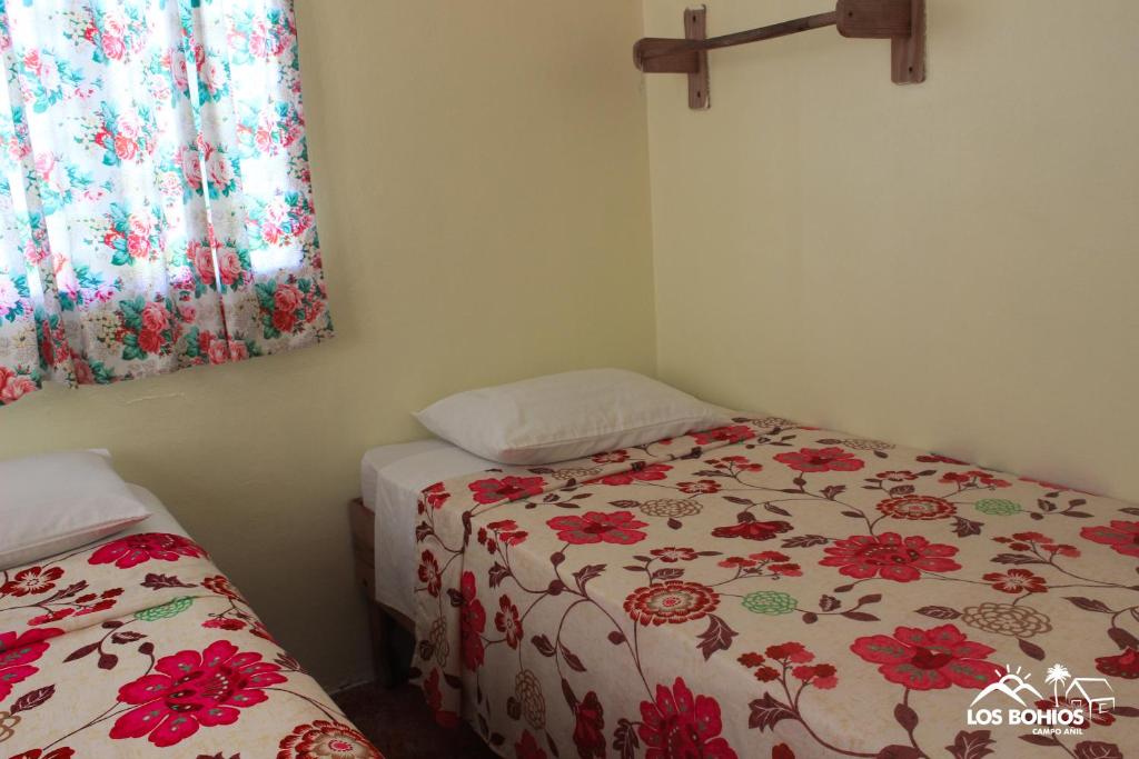 Postel nebo postele na pokoji v ubytování Los Bohios Campo Añil
