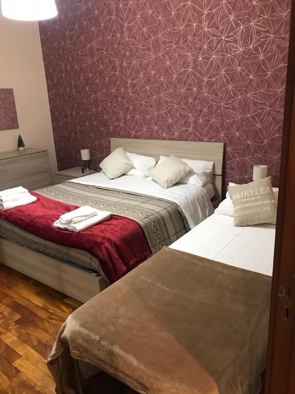 Postel nebo postele na pokoji v ubytování B&b Il miglio d’oro