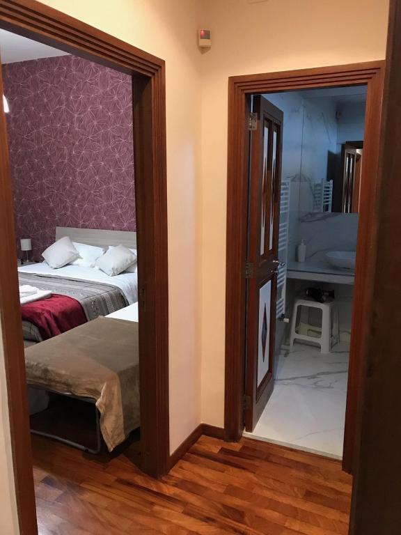Postel nebo postele na pokoji v ubytování B&b Il miglio d’oro