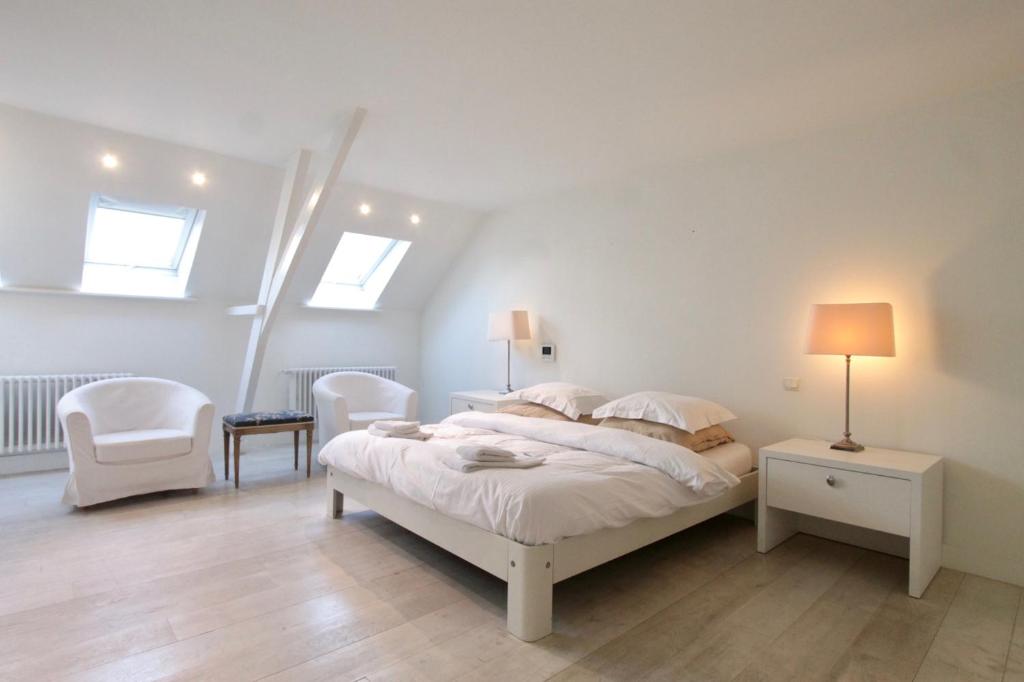 Een bed of bedden in een kamer bij Cap's House