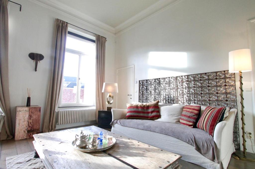 Een bed of bedden in een kamer bij Cap's House