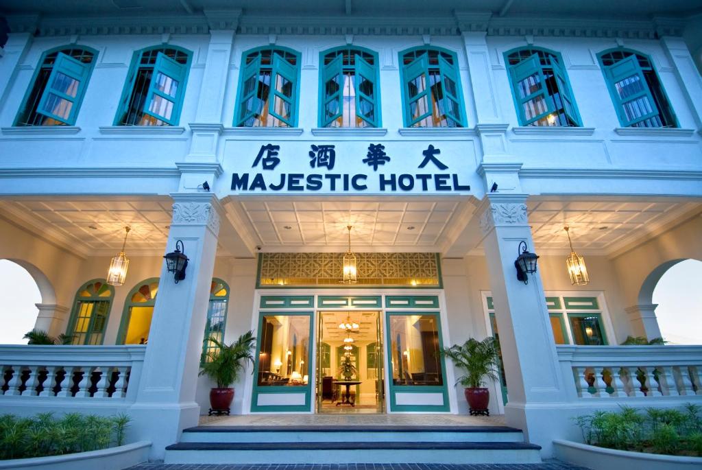 a hotel with the sign of the majestic hotel at The Majestic Malacca Hotel - Small Luxury Hotels of the World in Malacca