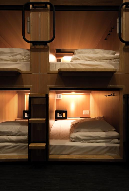 Postel nebo postele na pokoji v ubytování TSUKIMI HOTEL