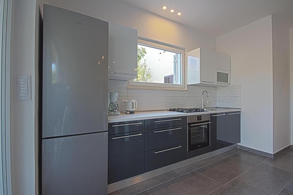 A cozinha ou kitchenette de Apartman Topolino
