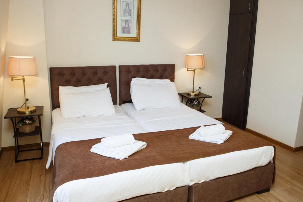 Postel nebo postele na pokoji v ubytování Hotel Arc Tbilisi