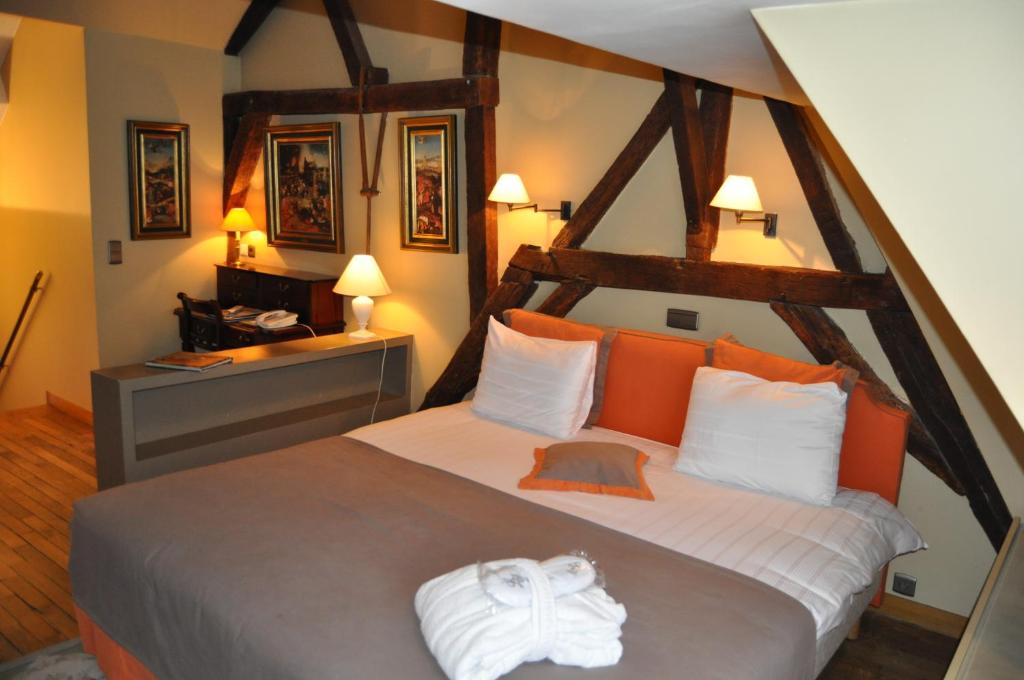 Postel nebo postele na pokoji v ubytování Hotel Le Dixseptième