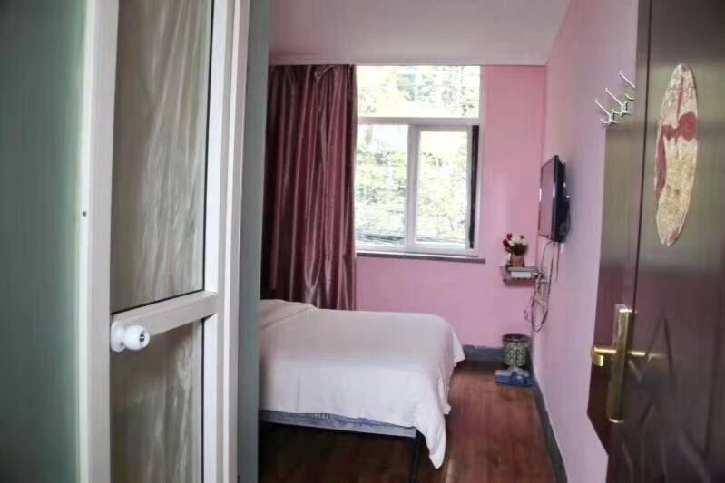 Postel nebo postele na pokoji v ubytování Xi'an The Facebook Youth Hostel