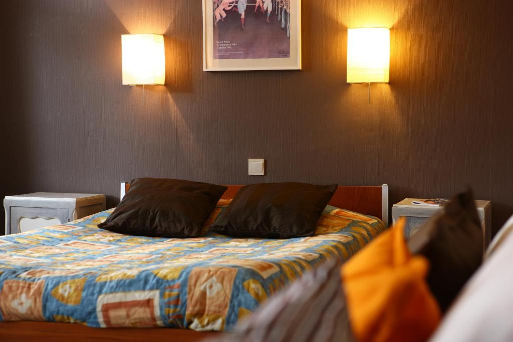 Postel nebo postele na pokoji v ubytování Hostellerie Hérock