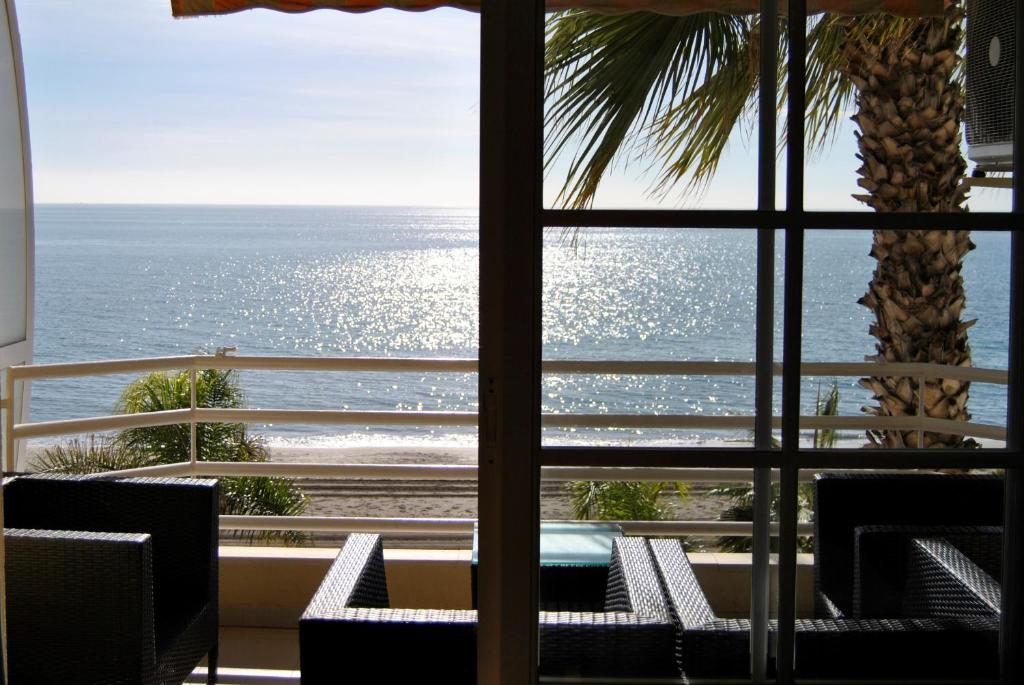 a view of the ocean from a hotel room at APARTAMENTO FRENTE AL MAR,PRIMERA LINEA in Rincón de la Victoria