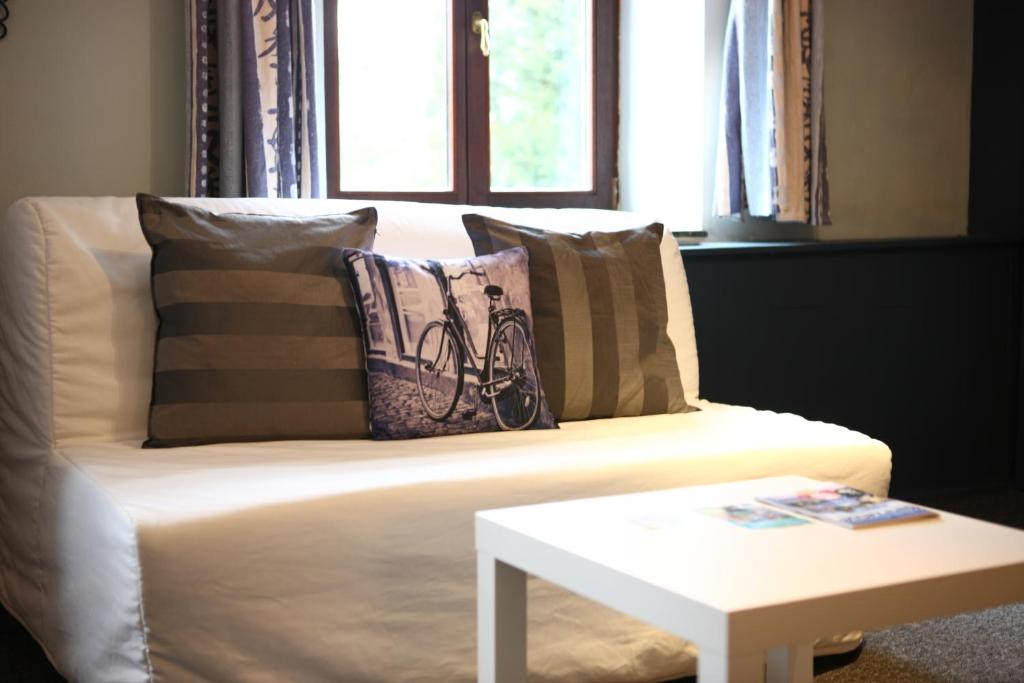Postel nebo postele na pokoji v ubytování Hostellerie Hérock
