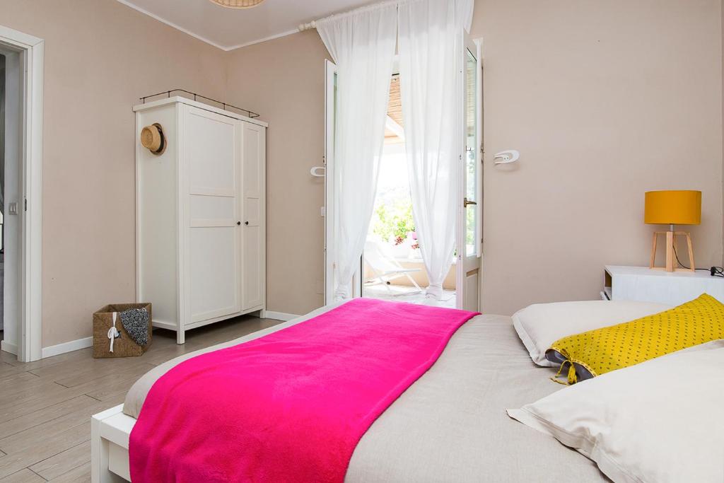 Łóżko lub łóżka w pokoju w obiekcie Villa Sea Rose