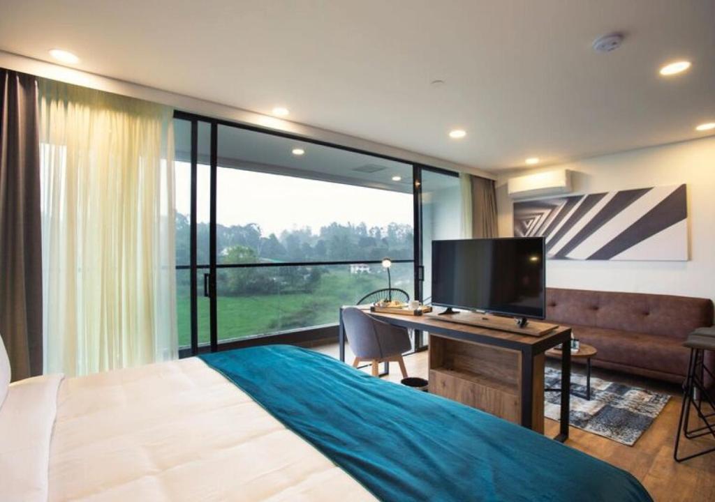 TV a/nebo společenská místnost v ubytování Hotel Lagoon