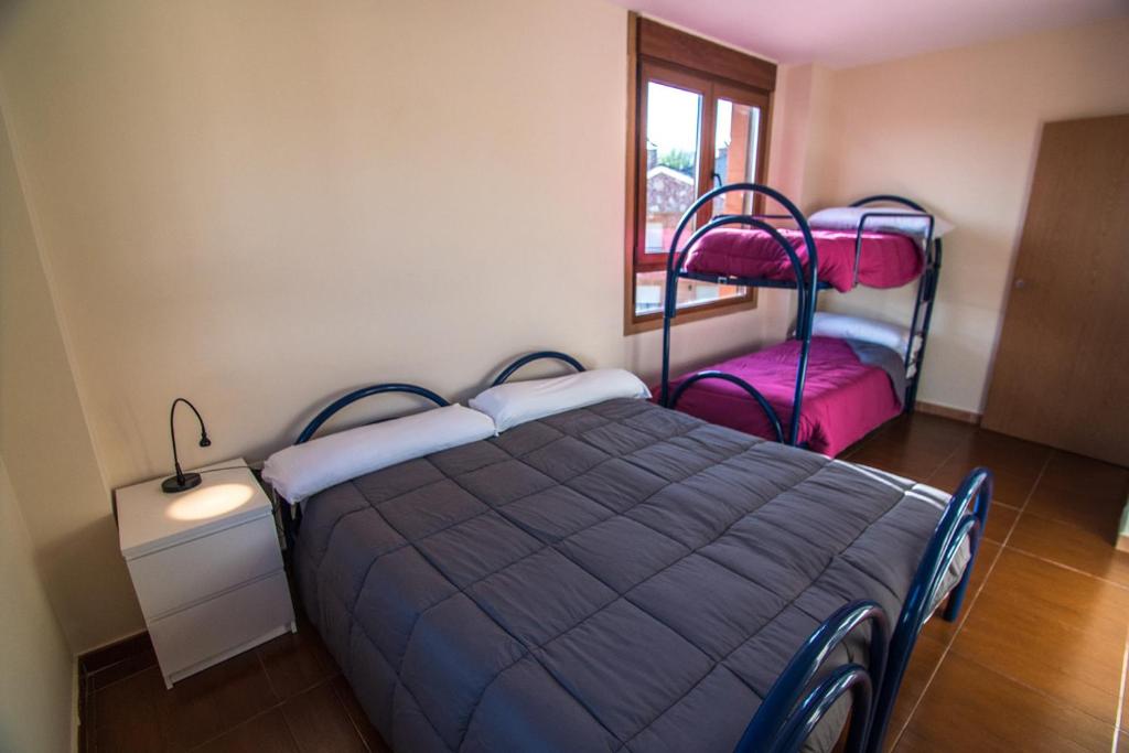 Postel nebo postele na pokoji v ubytování Albergue de Prioro