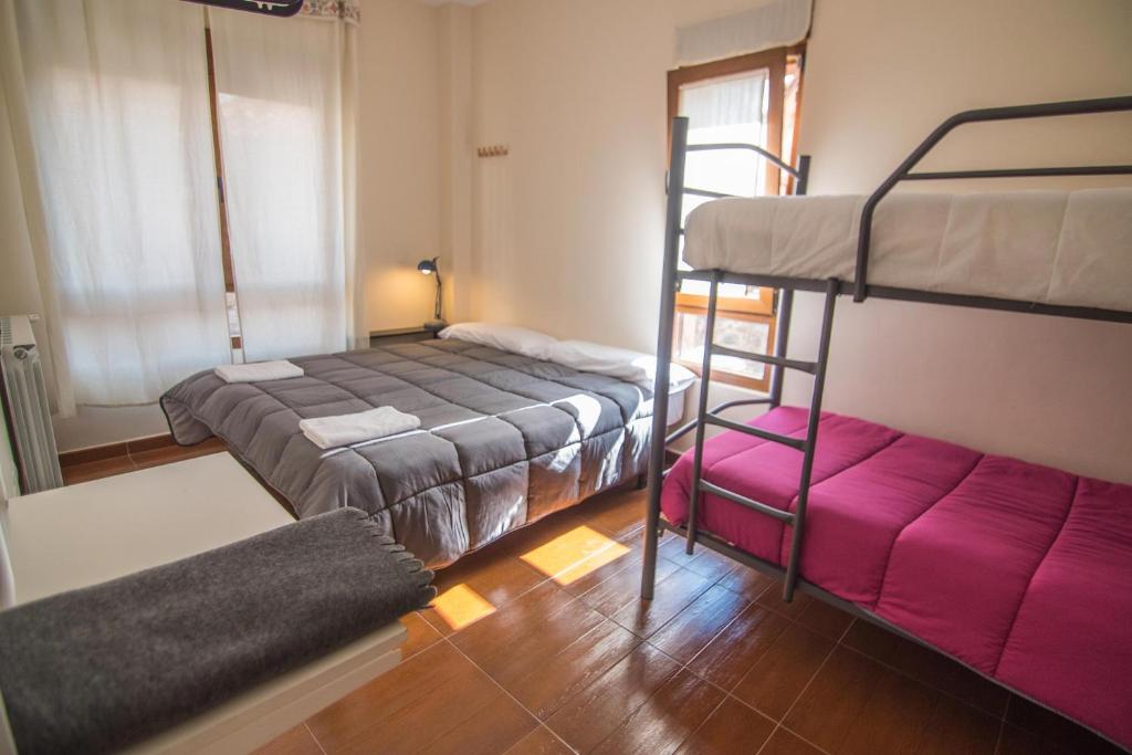 Postel nebo postele na pokoji v ubytování Albergue de Prioro