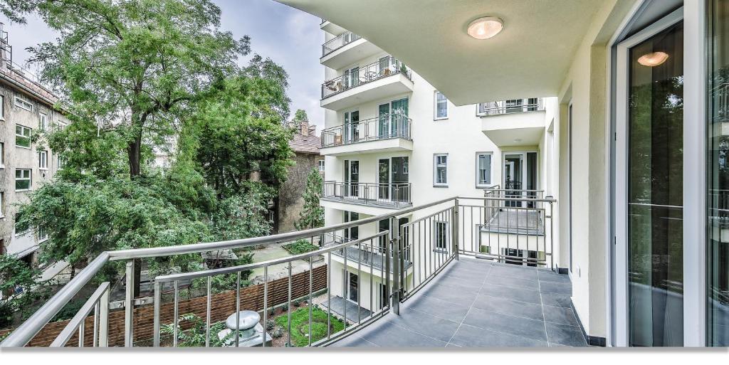 an apartment balcony with a view of a building at Nova City Apartments in Budapest