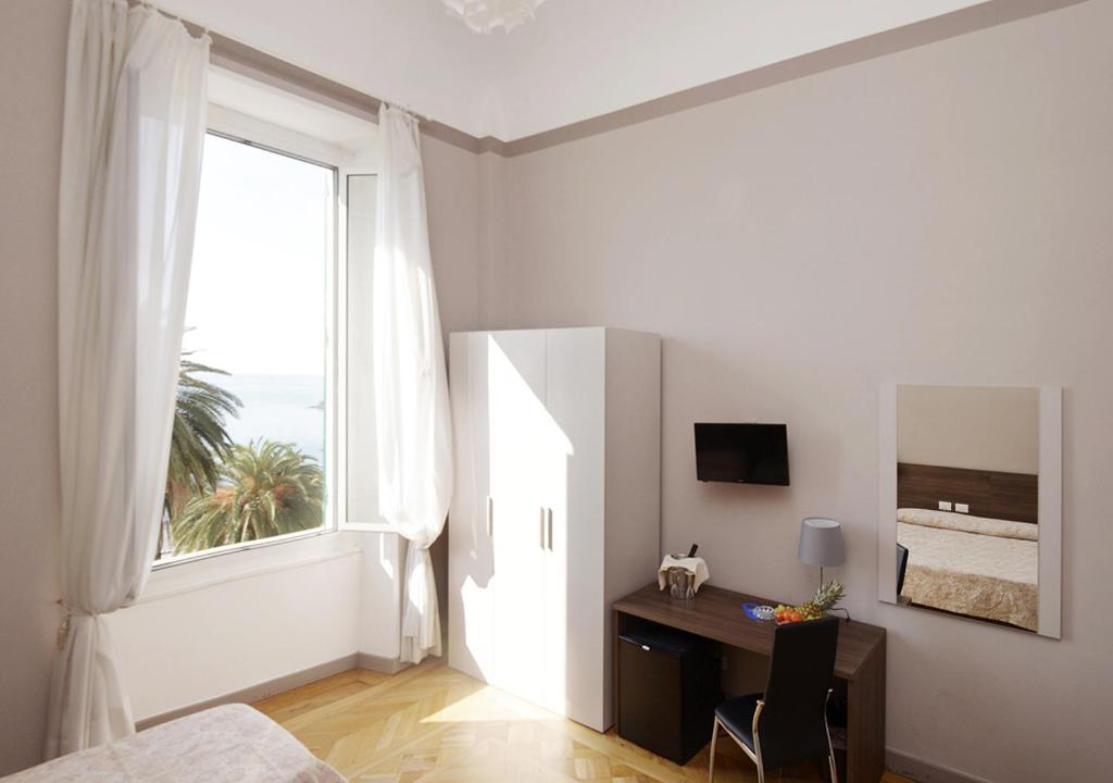 TV a/nebo společenská místnost v ubytování Hotel Mediterranee