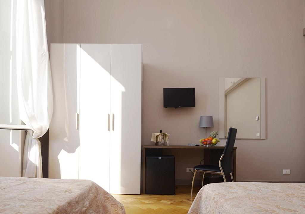 Postel nebo postele na pokoji v ubytování Hotel Mediterranee