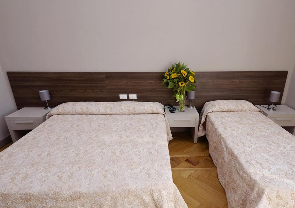 Postel nebo postele na pokoji v ubytování Hotel Mediterranee