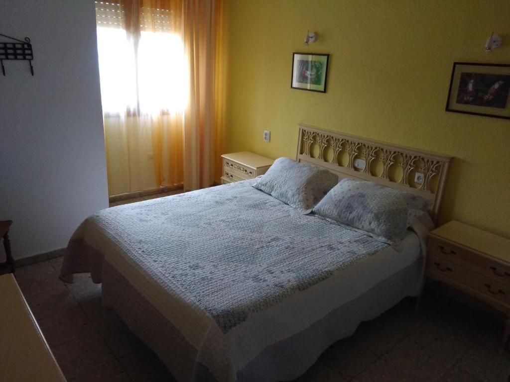 Postel nebo postele na pokoji v ubytování Hostal Avenida