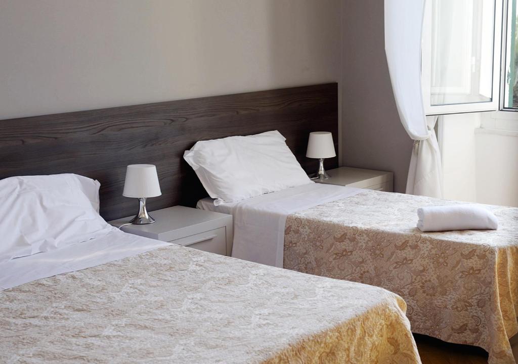 Postel nebo postele na pokoji v ubytování Hotel Mediterranee
