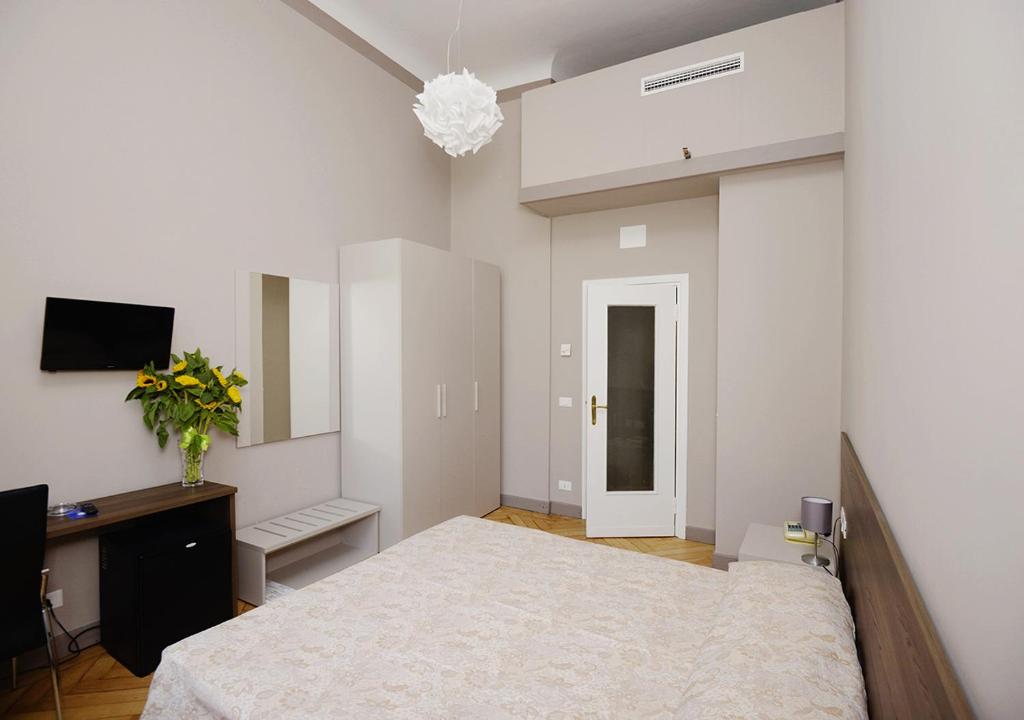 Postel nebo postele na pokoji v ubytování Hotel Mediterranee