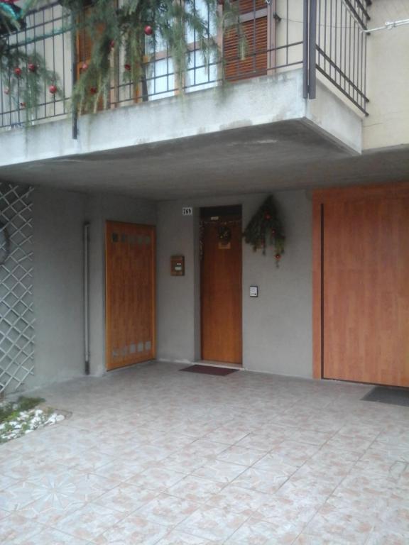 an empty building with two doors and a balcony at La Casa di Olga in Brescia