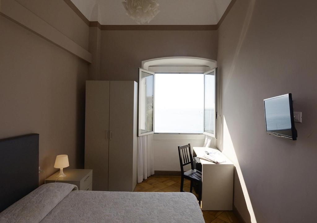 Postel nebo postele na pokoji v ubytování Hotel Mediterranee