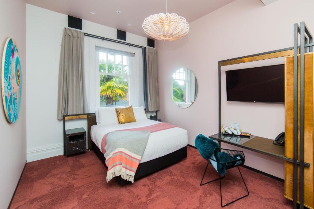 Postel nebo postele na pokoji v ubytování Clarence Boutique Hotel