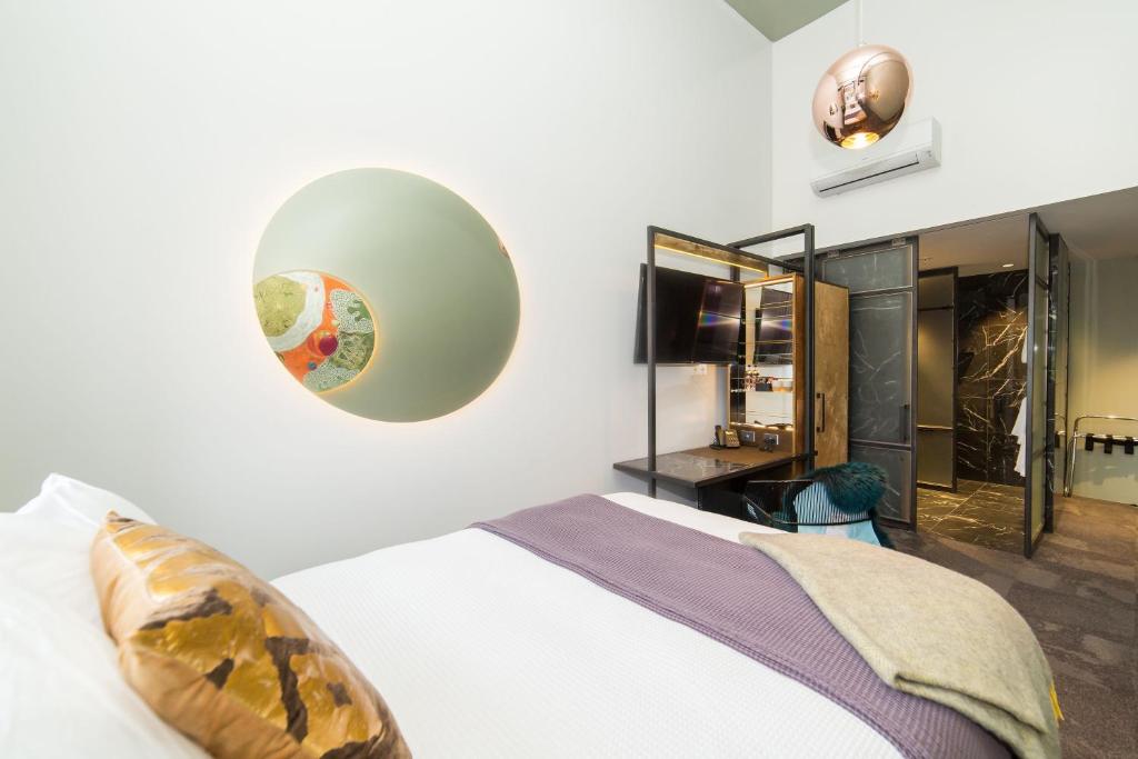 Postel nebo postele na pokoji v ubytování Clarence Boutique Hotel