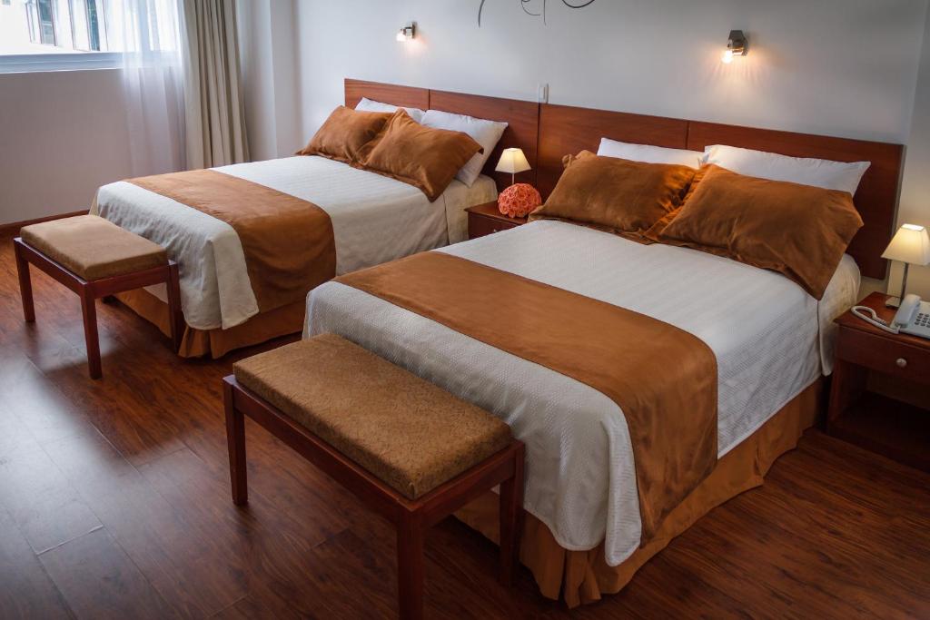 Postel nebo postele na pokoji v ubytování Hotel Ajavi