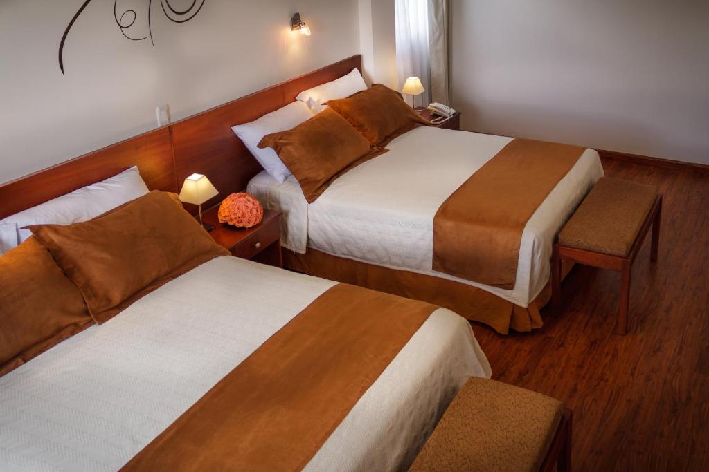 Postel nebo postele na pokoji v ubytování Hotel Ajavi