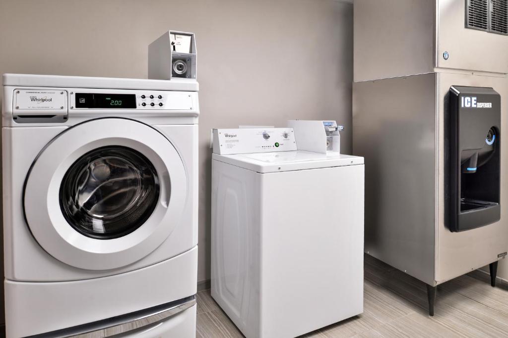 a washing machine and a dryer in a room at Cabana Shores Hotel in Myrtle Beach
