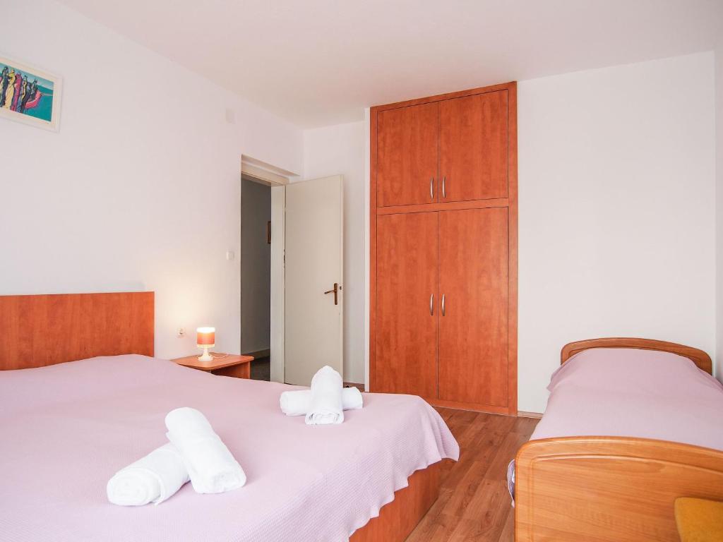 Postel nebo postele na pokoji v ubytování Apartments Dirk