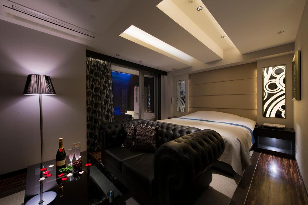 Postel nebo postele na pokoji v ubytování Hotel Moana Shinjuku (Adult Only)