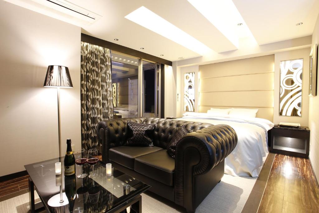 Postel nebo postele na pokoji v ubytování Hotel Moana Shinjuku (Adult Only)