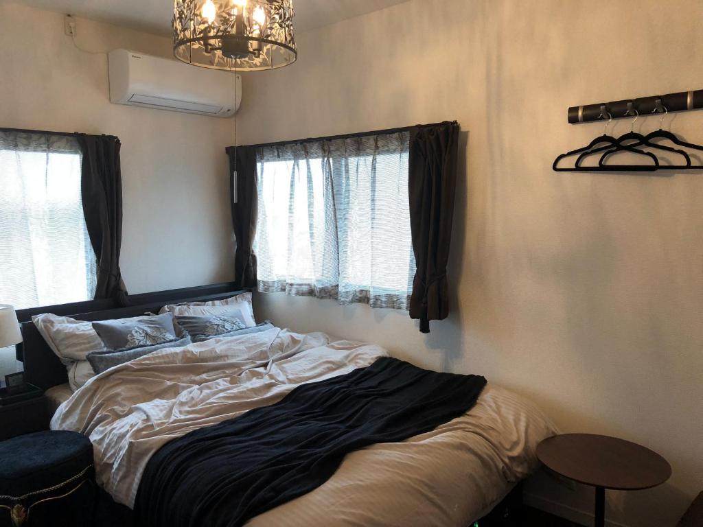 Posteľ alebo postele v izbe v ubytovaní Guest House "Ro"kumano