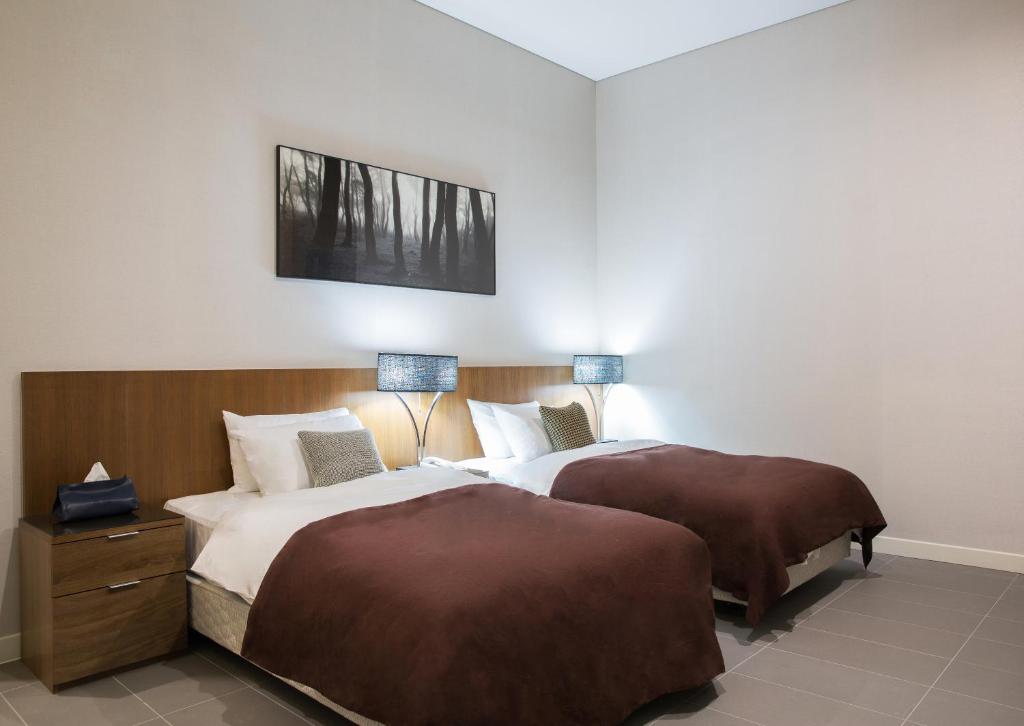 Postel nebo postele na pokoji v ubytování Hotel Mate Bundang