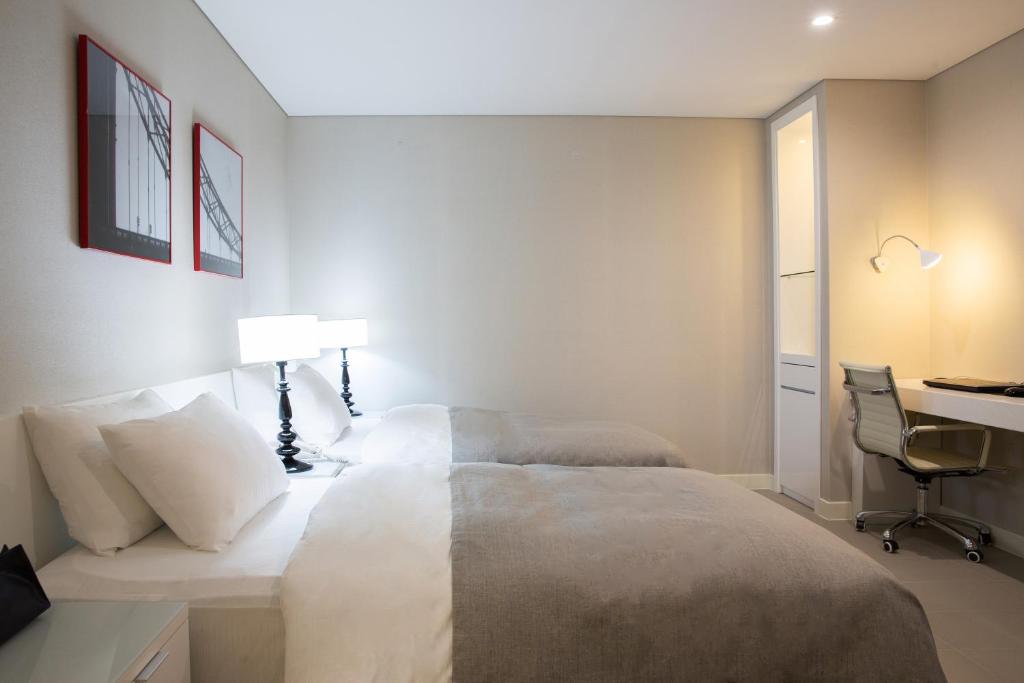 Postel nebo postele na pokoji v ubytování Hotel Mate Bundang