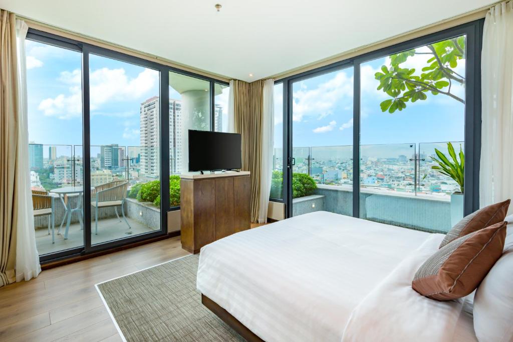 Postel nebo postele na pokoji v ubytování New Orient Hotel Da Nang