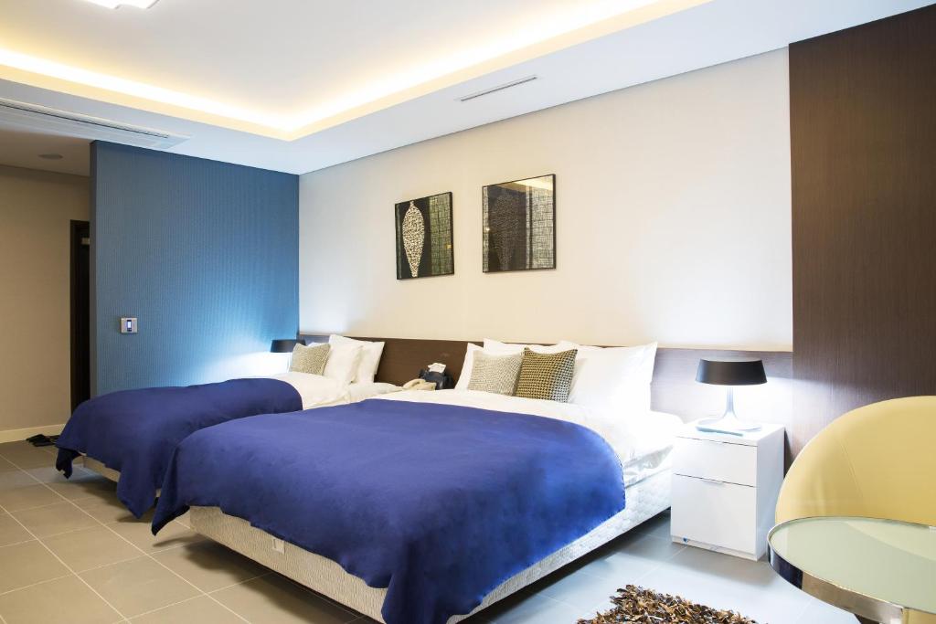 Postel nebo postele na pokoji v ubytování Hotel Mate Bundang